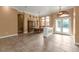 Spacious dining room, adjacent to entryway, with a large table and cabinetry at 3000 Narcissus Ter, North Port, FL 34286
