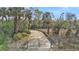 Long private driveway leading to property at 3000 Narcissus Ter, North Port, FL 34286
