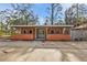Front view of a single story home with a covered porch at 3000 Narcissus Ter, North Port, FL 34286