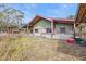 Green house with a covered porch and a partially visible yard at 3000 Narcissus Ter, North Port, FL 34286