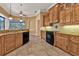 Kitchen with island, granite countertops, and ample cabinet space at 3000 Narcissus Ter, North Port, FL 34286