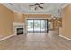Living room with fireplace and sliding glass doors to the lanai at 3000 Narcissus Ter, North Port, FL 34286