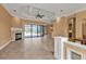 Living room with a fireplace and sliding glass doors leading to the pool at 3000 Narcissus Ter, North Port, FL 34286