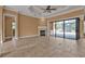 Spacious living room with a fireplace and access to the pool area at 3000 Narcissus Ter, North Port, FL 34286