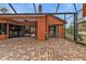 Screened patio with brick pavers, access to interior, and pool views at 3000 Narcissus Ter, North Port, FL 34286