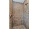 Large tiled shower with neutral tones at 3000 Narcissus Ter, North Port, FL 34286