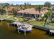 Waterfront home showcasing pool, dock, and boat at 3513 Terin Ct, Punta Gorda, FL 33950