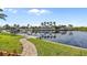 Private backyard with a pathway to the waterfront dock at 3513 Terin Ct, Punta Gorda, FL 33950