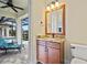 Bathroom with granite vanity and a view of the pool at 3513 Terin Ct, Punta Gorda, FL 33950