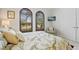 Bedroom with arched windows and neutral decor at 3513 Terin Ct, Punta Gorda, FL 33950