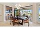 Elegant dining room with large windows and access to outdoor patio at 3513 Terin Ct, Punta Gorda, FL 33950
