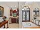 Elegant entryway with decorative flooring and a wet bar at 3513 Terin Ct, Punta Gorda, FL 33950