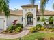 Inviting home exterior featuring a decorative front door and landscaping at 3513 Terin Ct, Punta Gorda, FL 33950