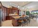Open kitchen features granite countertops, custom cabinetry, and breakfast bar at 3513 Terin Ct, Punta Gorda, FL 33950