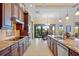 Eat-in kitchen with granite countertops, stainless steel appliances, and views to canal at 3513 Terin Ct, Punta Gorda, FL 33950