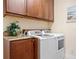 Laundry room with washer, dryer, and ample cabinet space at 3513 Terin Ct, Punta Gorda, FL 33950