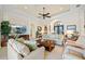 Bright and airy living room with ample seating and large TV at 3513 Terin Ct, Punta Gorda, FL 33950