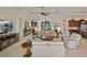 Open concept living room, featuring a large TV and comfortable seating at 3513 Terin Ct, Punta Gorda, FL 33950