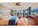 Serene main bedroom with hardwood floors, water views, and private balcony at 3513 Terin Ct, Punta Gorda, FL 33950