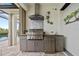Outdoor kitchen with stainless steel appliances and granite counters at 3513 Terin Ct, Punta Gorda, FL 33950