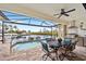 Relaxing pool area with patio furniture and water views at 3513 Terin Ct, Punta Gorda, FL 33950