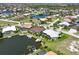 Aerial view of waterfront home showcasing dock and pool at 3663 Whippoorwill Blvd, Punta Gorda, FL 33950