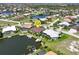 High-angle view of a waterfront house with a private dock and pool at 3663 Whippoorwill Blvd, Punta Gorda, FL 33950