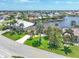 Beautiful waterfront property with lush landscaping at 3663 Whippoorwill Blvd, Punta Gorda, FL 33950