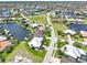 Aerial view of canal front home and neighborhood at 3663 Whippoorwill Blvd, Punta Gorda, FL 33950
