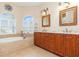 Bathroom boasts double vanity, soaking tub and shower at 3663 Whippoorwill Blvd, Punta Gorda, FL 33950