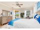 Bright bedroom with pool view, king-size bed, and coastal decor at 3663 Whippoorwill Blvd, Punta Gorda, FL 33950