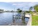 Waterfront property featuring a private boat lift at 3663 Whippoorwill Blvd, Punta Gorda, FL 33950