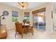Bright breakfast nook with wicker chairs and view of the patio at 3663 Whippoorwill Blvd, Punta Gorda, FL 33950