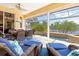Serene covered patio with water views and lounge seating at 3663 Whippoorwill Blvd, Punta Gorda, FL 33950