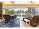 Spacious covered patio with comfortable seating and pool access at 3663 Whippoorwill Blvd, Punta Gorda, FL 33950