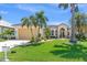 House with a two-car garage and nicely landscaped yard at 3663 Whippoorwill Blvd, Punta Gorda, FL 33950