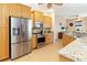 Modern kitchen with stainless steel appliances and light wood cabinets at 3663 Whippoorwill Blvd, Punta Gorda, FL 33950