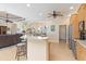 Eat-in kitchen with breakfast bar, granite countertops, and stainless steel appliances at 3663 Whippoorwill Blvd, Punta Gorda, FL 33950