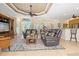 Open concept living area with comfortable seating and views into the kitchen and dining areas at 3663 Whippoorwill Blvd, Punta Gorda, FL 33950