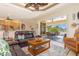 Comfortable living room with leather sofas and view of patio at 3663 Whippoorwill Blvd, Punta Gorda, FL 33950