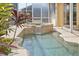 Tranquil pool and spa with water feature at 3663 Whippoorwill Blvd, Punta Gorda, FL 33950