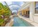 Relaxing pool and spa with lush landscaping at 3663 Whippoorwill Blvd, Punta Gorda, FL 33950