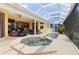 Inviting pool and spa area with covered patio at 3663 Whippoorwill Blvd, Punta Gorda, FL 33950