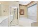 Bathroom with corner soaking tub and double vanity at 3932 Madrid Ct, Punta Gorda, FL 33950