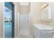 Bathroom with a shower and vanity; pool view at 3932 Madrid Ct, Punta Gorda, FL 33950