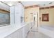 Bathroom with double vanity and soaking tub at 3932 Madrid Ct, Punta Gorda, FL 33950