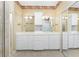 Bathroom with double vanity and large mirror at 3932 Madrid Ct, Punta Gorda, FL 33950