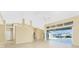 Open living area with high ceilings, tile floors and access to the pool and patio at 3932 Madrid Ct, Punta Gorda, FL 33950