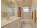 Clean bathroom with a bathtub, shower, and vanity at 4046 Lubec Ave, North Port, FL 34287