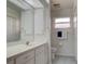 Clean bathroom with double vanity and separate toilet area at 4046 Lubec Ave, North Port, FL 34287